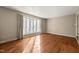 The living room has hardwood floors and a big window that lets in lots of natural light at 405 Lookout Pt, Rougemont, NC 27572
