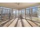 Bright sunroom with sliding glass doors, natural light, and a ceiling fan for comfort at 405 Lookout Pt, Rougemont, NC 27572