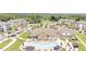 Aerial view of community featuring a pool, clubhouse, manicured lawns, and plentiful parking at 5006 Tura St, Raleigh, NC 27610