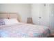 Cozy bedroom features a linen headboard and a plush floral quilt at 5006 Tura St, Raleigh, NC 27610