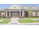 Grand entrance to the community clubhouse with manicured landscaping at 5006 Tura St, Raleigh, NC 27610