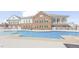 Inviting community pool surrounded by lounge chairs and tables at 5006 Tura St, Raleigh, NC 27610