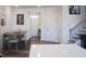 Dining area next to the stairs featuring a table with chairs, neutral colors, and modern wall art at 5006 Tura St, Raleigh, NC 27610