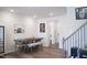 Cozy dining area featuring a wooden table with bench seating and unique art pieces displayed on the walls at 5006 Tura St, Raleigh, NC 27610