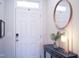 Inviting entryway featuring a stylish console table and elegant decor with door to outside at 5006 Tura St, Raleigh, NC 27610