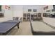 Spacious game room with ping pong table, pool table, and arcade games for entertainment at 5006 Tura St, Raleigh, NC 27610