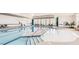 Bright indoor pool area with ample seating and natural light from large windows at 5006 Tura St, Raleigh, NC 27610