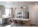 Well-equipped kitchen showcases quartz countertops, stainless steel appliances, and stylish pendant lighting at 5006 Tura St, Raleigh, NC 27610