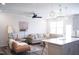 Comfortable living room area with plush sofa, ceiling fan, and natural light; ideal for relaxation at 5006 Tura St, Raleigh, NC 27610