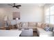 Bright and airy living room featuring a comfortable sectional sofa, stylish decor, and ample natural light at 5006 Tura St, Raleigh, NC 27610
