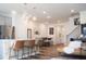 Inviting open-concept living space with stylish pendant lighting, hardwood floors, and modern furniture at 5006 Tura St, Raleigh, NC 27610