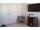 Flex room area includes television and printer, along with closet space and chair at 5006 Tura St, Raleigh, NC 27610