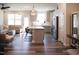 Bright open-concept layout featuring a kitchen with island seating connected to a comfortable living area at 5006 Tura St, Raleigh, NC 27610