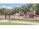 Fenced playground with slides, climbing areas, and a swing set for safe play at 5006 Tura St, Raleigh, NC 27610