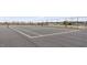 This fenced tennis court boasts an asphalt surface with clear white lines for competitive play at 5006 Tura St, Raleigh, NC 27610