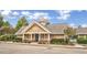 The community clubhouse featuring covered porch, stone accents and manicured landscaping at 528 Opposition Way Way, Wake Forest, NC 27587
