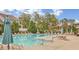 Large community pool surrounded by lounge chairs and shade umbrellas for relaxation at 528 Opposition Way Way, Wake Forest, NC 27587
