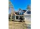 Beautiful two-story home featuring a covered porch and attached garage with blue and gray exterior at 528 Opposition Way Way, Wake Forest, NC 27587