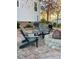 Outdoor patio area with stylish Adirondack chairs, a fire pit, and a built-in grill station at 528 Opposition Way Way, Wake Forest, NC 27587