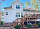 The rear exterior of the home showcases a wooden deck and multiple windows for ample natural light at 528 Opposition Way Way, Wake Forest, NC 27587