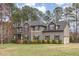 Charming two-story home with stone accents, shutters, and a well-manicured lawn at 6712 Stepherly Way, Holly Springs, NC 27540