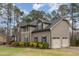 Attractive two-story home boasting a two-car garage, well-maintained lawn, and complementary landscaping for enhanced curb appeal at 6712 Stepherly Way, Holly Springs, NC 27540