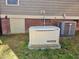 Home generator is located on the side of the home with A/C unit in view at 6712 Stepherly Way, Holly Springs, NC 27540