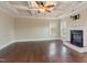 Expansive living room with hardwood floors, trey ceiling and fireplace at 6712 Stepherly Way, Holly Springs, NC 27540