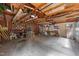 Spacious garage interior showing wood beams, pegboard, and ample storage potential at 7101 Winding Way, Wake Forest, NC 27587