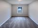 Bedroom with a bright window overlooking the backyard, neutral walls, and carpeted flooring at 737 Little Patch St, Zebulon, NC 27597