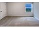 Bedroom featuring neutral walls, carpeted flooring, bright window, and closet at 737 Little Patch St, Zebulon, NC 27597