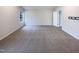 Bedroom with carpeted floors, a bright window, and adjacent ensuite bathroom at 737 Little Patch St, Zebulon, NC 27597