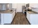 Well-equipped kitchen with stainless steel appliances, granite countertops and an open layout perfect for entertaining at 737 Little Patch St, Zebulon, NC 27597