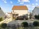 Backyard featuring a covered deck, a well-maintained lawn, and privacy bushes around the perimeter at 7520 Channery Way, Raleigh, NC 27616