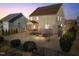 Backyard featuring a covered deck, a well-maintained lawn, and privacy bushes around the perimeter at 7520 Channery Way, Raleigh, NC 27616