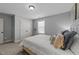 Serene bedroom with soft hues, window views, and a comfortable bed creates a relaxing and tranquil environment at 7520 Channery Way, Raleigh, NC 27616
