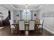 Refined dining room with coffered ceiling, stylish decor, and ample seating at 7520 Channery Way, Raleigh, NC 27616