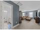 Spacious living room with neutral walls and carpet, a large sectional couch, and a view into the bathroom at 7520 Channery Way, Raleigh, NC 27616