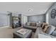 Comfortable living room with stylish sectional sofa, neutral palette, and cozy decor provides a relaxing gathering space at 7520 Channery Way, Raleigh, NC 27616