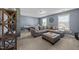 A spacious living room with comfortable seating, ample light, and simple decor offers a perfect relaxation area at 7520 Channery Way, Raleigh, NC 27616