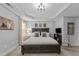 Comfortable main bedroom features neutral decor, a large bed, and stylish furnishings for a relaxing and inviting atmosphere at 7520 Channery Way, Raleigh, NC 27616
