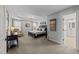 Expansive main bedroom with tray ceiling, sitting area, and ensuite bath offers a luxurious retreat with abundant natural light at 7520 Channery Way, Raleigh, NC 27616