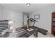 Office with a desk, treadmill, and a window offering natural light, perfect for a home workspace at 7520 Channery Way, Raleigh, NC 27616