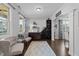 Elegant wine room with custom shelving, stylish seating, and natural light at 7520 Channery Way, Raleigh, NC 27616