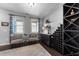 Chic wine room with seating, custom shelving, and sophisticated decor at 7520 Channery Way, Raleigh, NC 27616