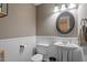 Powder room with wainscoting and pedestal sink at 8617 Canoe Ct, Raleigh, NC 27615