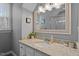 Bathroom featuring granite countertops and a decorative framed mirror at 8617 Canoe Ct, Raleigh, NC 27615