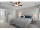 Spacious bedroom features neutral walls, ceiling fan, and ensuite bathroom at 8617 Canoe Ct, Raleigh, NC 27615