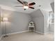 Bedroom with lighted ceiling fan and a desk with a mirror at 8617 Canoe Ct, Raleigh, NC 27615
