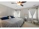 Spacious bedroom features neutral walls, ceiling fan, and bright natural light at 8617 Canoe Ct, Raleigh, NC 27615